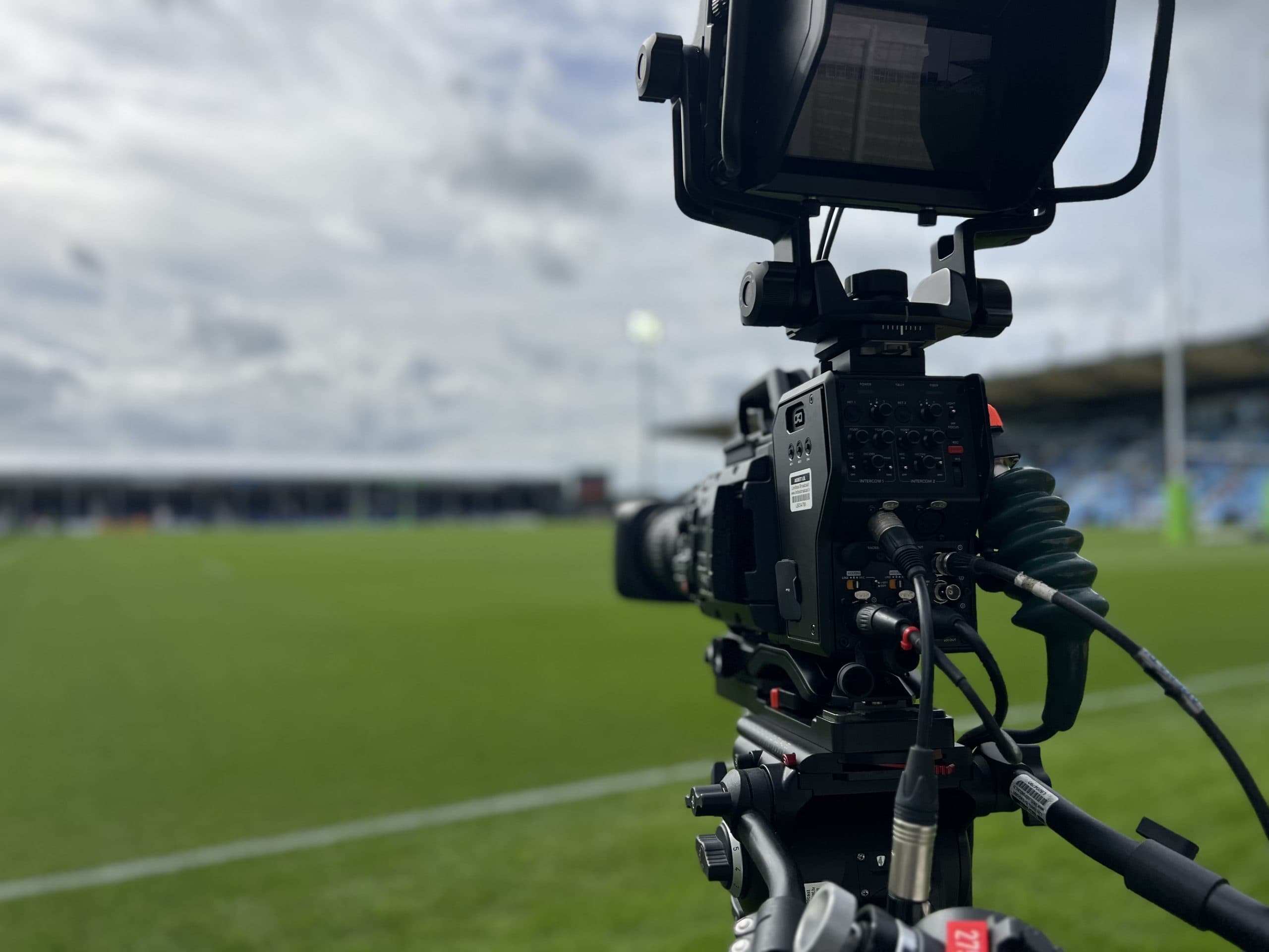 A broadcast television camera trackside at a live sports event